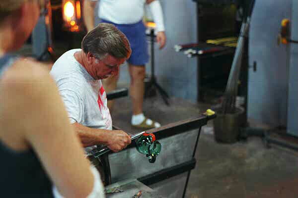 Walter Evans working a vase mold piece, adding second handle