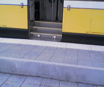 Raised platform section showing door alignment with staired entry when train stops at high level entry and barrier to direct access.