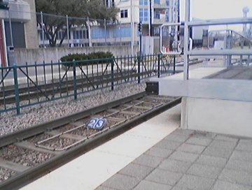 High level train entry platform provided in all stations at leading end of trains.  Also shows numbered signs between rails for train stopping point when high level is not needed - Cedars Station
