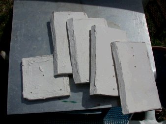 Square clay mold broken apart from pressure of glass and weak joints