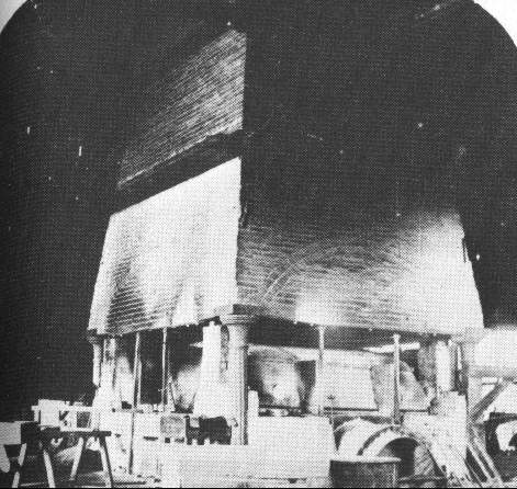 Interior of glass house showing furnace and air flow control