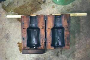 Wooden mold of bottle open for display