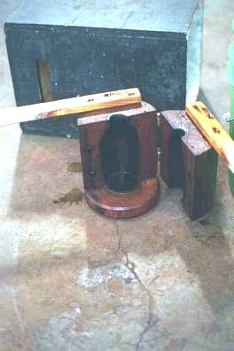 Tumbler mold, upright as used, with step up behind for use