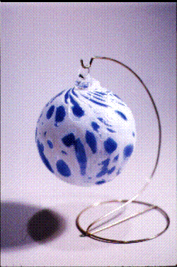 Blue/white blown ornament on stand