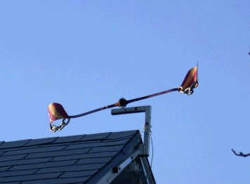 Metal whirly on roof, side view