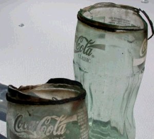 Thick walled Coke bottles "cut" with burning string.