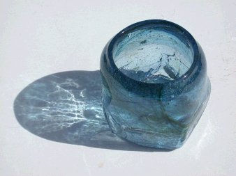 Cup blown in pentagon clay mold