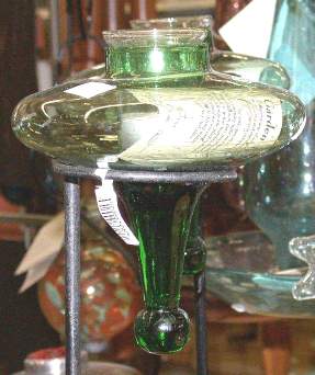 A candle holder for mounting in a ring, with a solid stem