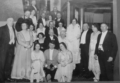 Louise Kelly and E.B.Kelly in group photo in & at Putnam House