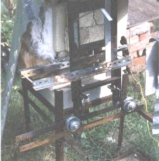 Very first furnace with door of insulating fire brick clamped in frame