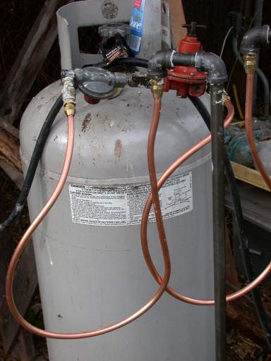 Copper tubing with flare fittings used to connect tank to iron pipe.